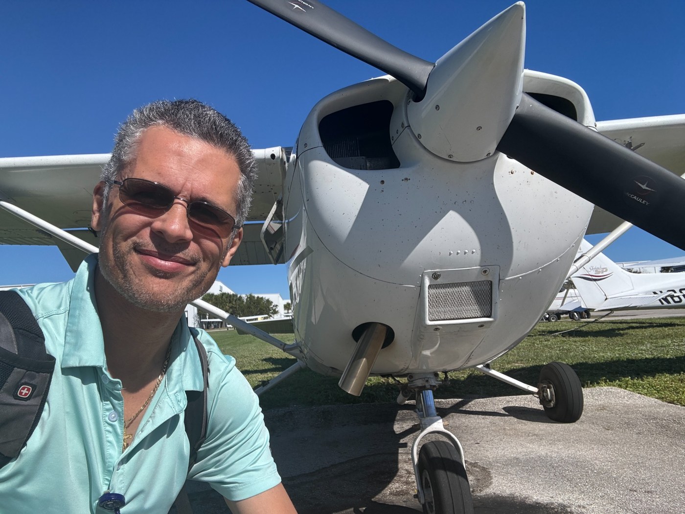 TrueVector Aviation instructor standing beside an aircraft on the ramp